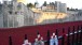 Paul Cummins, Blood Swept Lands and Seas of Red, Tower of London. Tributes to fallen soldiers have been pinned to the railings in many places round the Tower