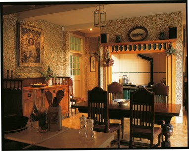 In the kitchen is another Morris pattern on the walls, this time the delicate ‘Sweetbriar’. The Aga stove surround was carefully designed in the style of C.F.A. Voysey