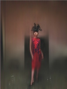 Cut out anarchy symbol hat, foam: Philip Treacy and Simon Periton, A/W 1999. Red silk dress with blue appliquéd leather detailing, silk & leather: Tristan Webber, S/S 2000. Shoes: Manolo Blahnik. Model: Xiao Wen Ju at IMG. © Nick Knight