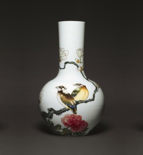 Yongzheng, Qing Dynasty, 1644–1911, China. Bottle Vase, early eighteenth century. Porcelain decorated with polychrome flowers and birds, height 20 cm (7 3⁄4 inches)