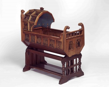 Gothic Style Cradle Designed by Richard Norman Shaw (1831 - 1912) & made for the son of the architect Alfred Waterhouse (1830 - 1905) English c.1861 ©V&A images