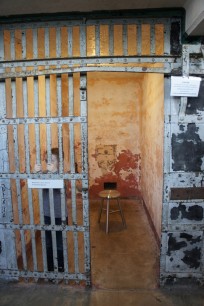 ‘Stay Tuned’, Cellblock A, cell with stool for listening to poem ‘A Homesick Sparrow’ by Sudanese poet Mahjoub Sharif. Detail of @Large, photograph by Susan Platt