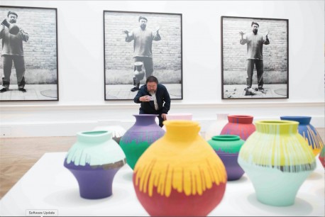 Ai Weiwei taking a photograph of his installation Coloured Vases, Royal Academy of Arts, 2015.  Photo courtesy of Royal Academy of Arts, London. Photography © Dave Parry