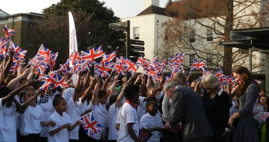 Excited children welcome the Royals