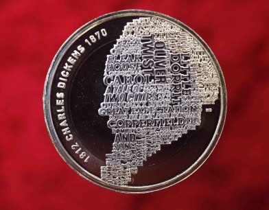 The new £2 British coin in honour of Charles Dickens. The author's profile is constructed typographically from the titles of some of his works