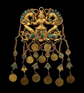 One of a pair of pendants depicting the "Dragon Master" (Tillya Tepe, Tomb II), 1st century BC–1st century AD. Gold, turquoise, garnet, lapis lazuli, carnelian, and pearl