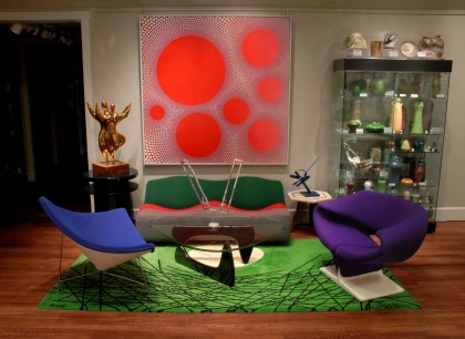 Kirkland Museum interior. Wave Sofa and Ribbon Chair (rt.)– P. Paulin; Ion Chair – G. Kramer; Biomorphic Table – I. Noguchi; glass case of Van Briggle Pottery; lamp – V. Panton; sculpture – E. Britton; painting Seven Red Suns in Grey by Vance Kirkland