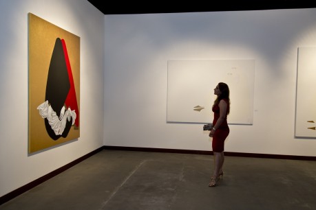 A guest at the opening of Aidan Salakhova's show admires one of the artist's works