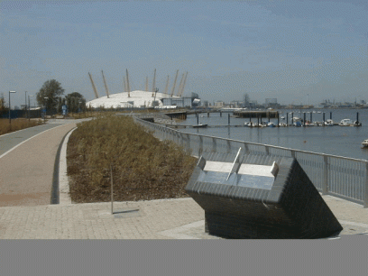 Sundial designed by Piers Nicholson, Greenwich, with the Millennium Dome behind