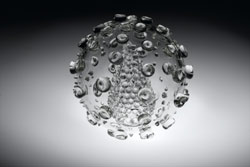 Luke Jerram, 800mm blown glass sculpture of HIV, created to counter the artificially coloured, often fear-inducing media images. Designed using scientific photographs & models and made in collaboration with glassblower Kim George © Luke Jerram 2004/Wellco