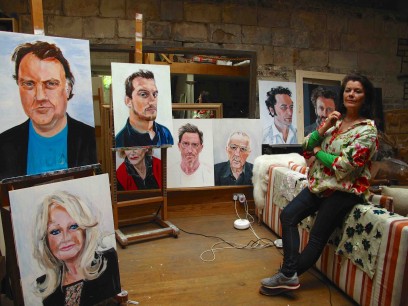 Janet Lance Hughes with some of her portraits