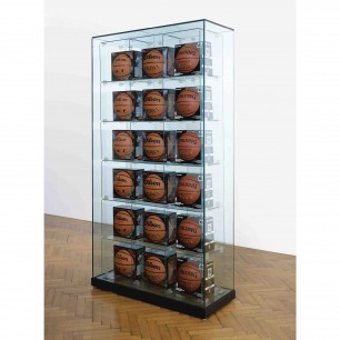 Jeff Koons, Encased - Three Rows (6 Wilson Jet Basketballs, 6 Wilson Michael Jordan Basketballs, 6 Spalding Zi/O Basketballs), 1983–93/98, Glass, plastic, steel, basketballs, 203.2 x 108 x 43.8cm. Image courtesy of Private Collection, London