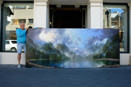 Artist Tim Wilson with one of his paintings