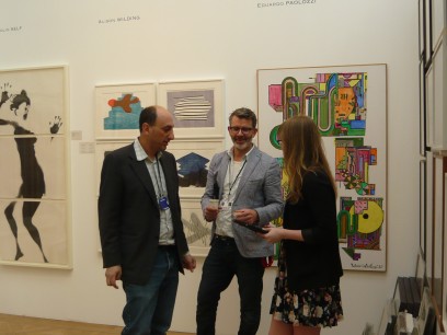 Richard Saltoun and Ben Parsons talk with a visitor to the Richard Saltoun/Karsten Schubert stand