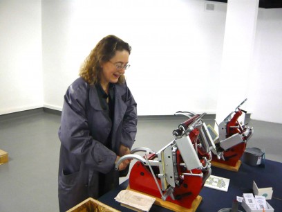 Frances Follin tests her strength on a 'baby' Platen printing press