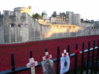 Paul Cummins, Blood Swept Lands and Seas of Red, Tower of London. Tributes to fallen soldiers have been pinned to the railings in many places round the Tower