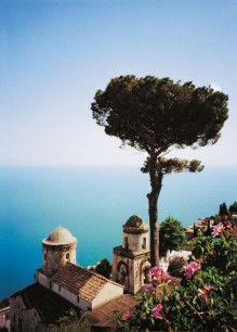 A giant umbrella pine frames the famous view from the terrace, over twin domes, out into the Gulf of Salerno.