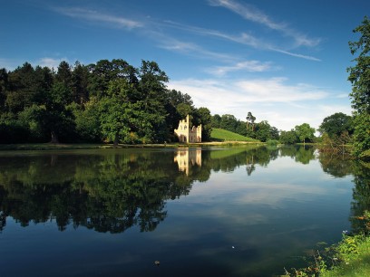 Painshill: The Ruined Abbey and vineyard from across the lake