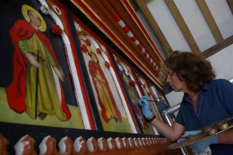 Painting the rood screen in St Teilo's church