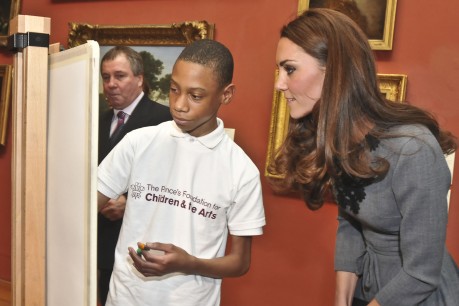 The Duchess of Cambridge examines the work of a young artist