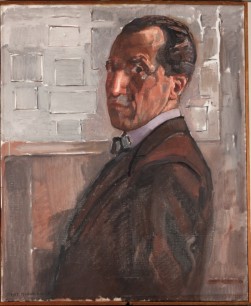 Piet Mondrian, Self Portrait, 1918. Oil on canvas. 88 x 73 cm. In the background a construction of planes in non-colour. Piet Mondrian: The Studios by Cees W. de Jong (ed)