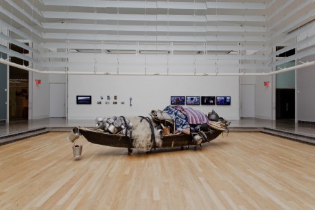 Subodh Gupta, (b.1964 Bihar, India) What does the vessel contain that the river does not? 2014, found boat, and other objects. 573x152.4x122cm. Photo by Hai Zhang, Courtesy of the Queens Museum of Art