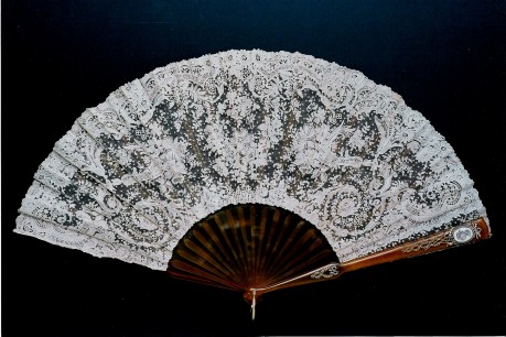 ‘Faberge’.Blonde tortoiseshell fan with fine point de gaze lace leaf. C.1890’s. The Fan Museum, HA Collection.