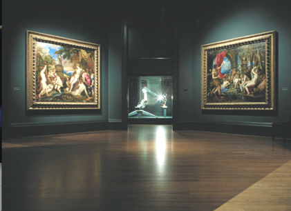 Installation view of Metamorphoses. L to R: Titian, Diana and Callisto, 1556–9; Conrad Shawcross, Trophy 2012, robot; Titian, Diana and Actaeon, 1556–9. Photo ©2013 Stephen White. Courtesy the Artist and Victoria Miro Gallery, London