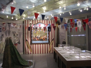 Louisa, Duchess of Devonshire's fancy dress; a Punch and Judy tent with Royal Procession puppets; a table laid for rich and poor; a fancy dress costume from Norfolk