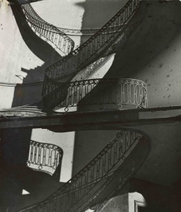 Bill Brandt, Bombed Regency Staircase, Upper Brook Street, Mayfair (c.1942). Gelatin silver print, 22.8 x 19.4 cm. The Museum of Modern Art. Acquired through the generosity of Clarissa A. Bronfman. © 2012 Bill Brandt Archive Ltd.