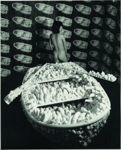 Yayoi Kusama,  Kusama posing in Aggregation: One Thousand Boats Show 1963  Installation view, Gertrude Stein Gallery, New York  © Yayoi Kusama and © Yayoi Kusama Studios Inc.