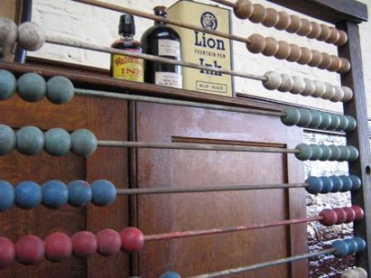 An abacus used to perform arithmetic in the days before electronic calculators. An experienced user can still make calculations more quickly than most people can using an electronic calculator.