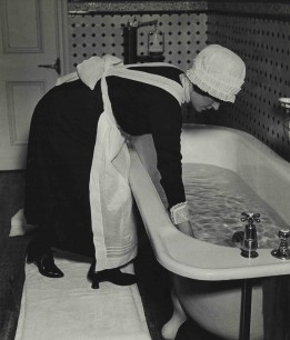 Bill Brandt, Parlourmaid Preparing a Bath before Dinner.  (c.1936). Gelatin silver print. 23 x 19.5 cm. The Museum of Modern Art. Horace W. Goldsmith Fund through Robert B. Menschel. © 2012 Bill Brandt Archive Ltd.