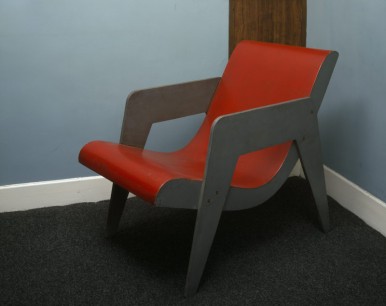 A wooden chair in the guest bedroom, designed by Erno Goldfinger, painted red and grey. www.nationaltrust.org.uk