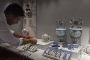 Ben Miller, museum assistant, looks a Green Jasperware teacup