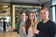 Time to celebrate! Caption Hilton Award: Bar Manager Andy Hallam ( front) with students Maria Sousa Machado (20) and Sam Barber (21)