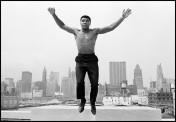 Muhammad Ali, former boxing world heavy weight champion, in Chicago, jumping from a bridge over the Chicago River. 1966. © Thomas Hopeker / Magnum Photos