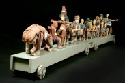 Steve Hurst, March of Folly (2005). Carved wood